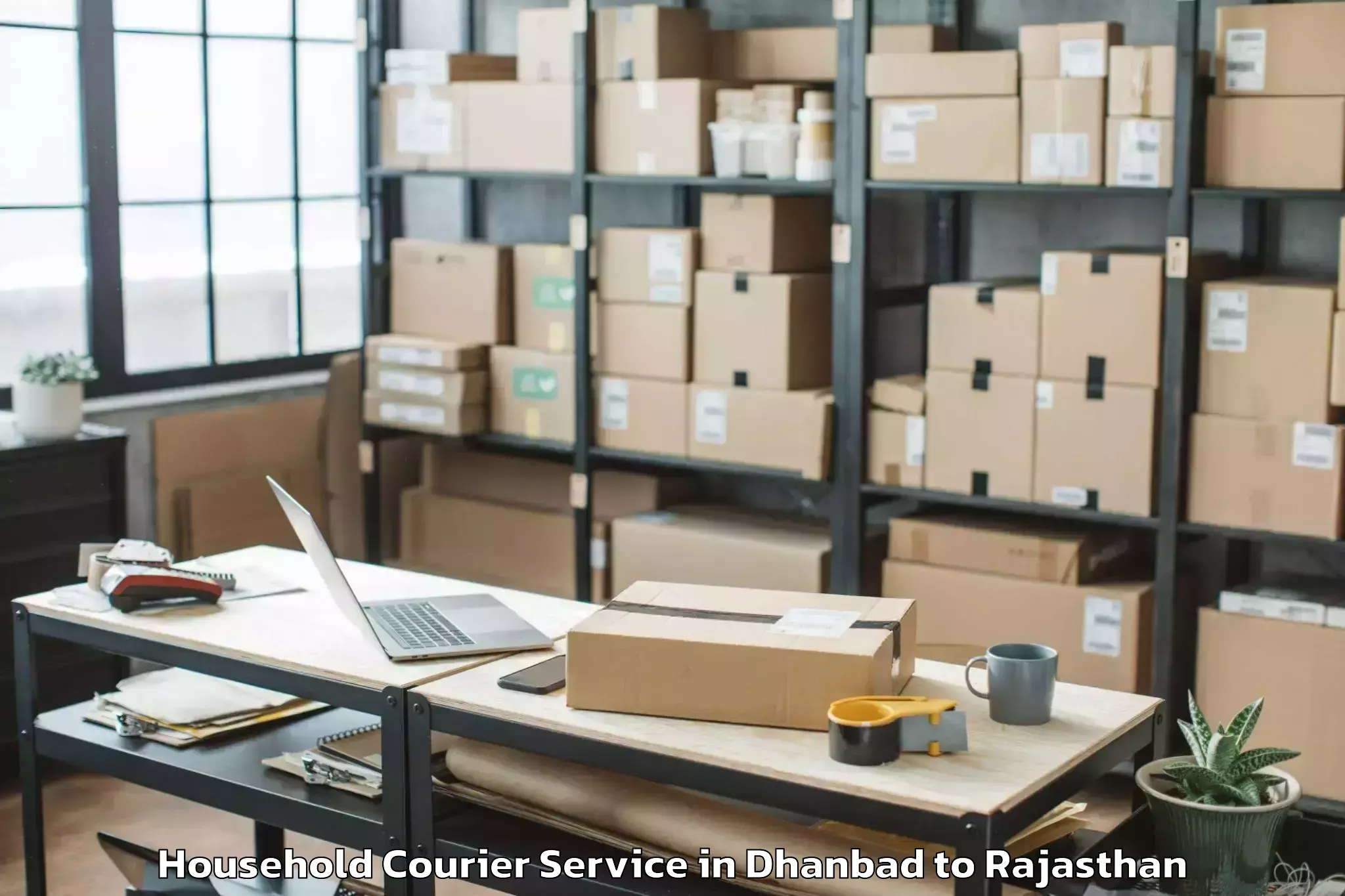 Affordable Dhanbad to Central University Of Rajastha Household Courier